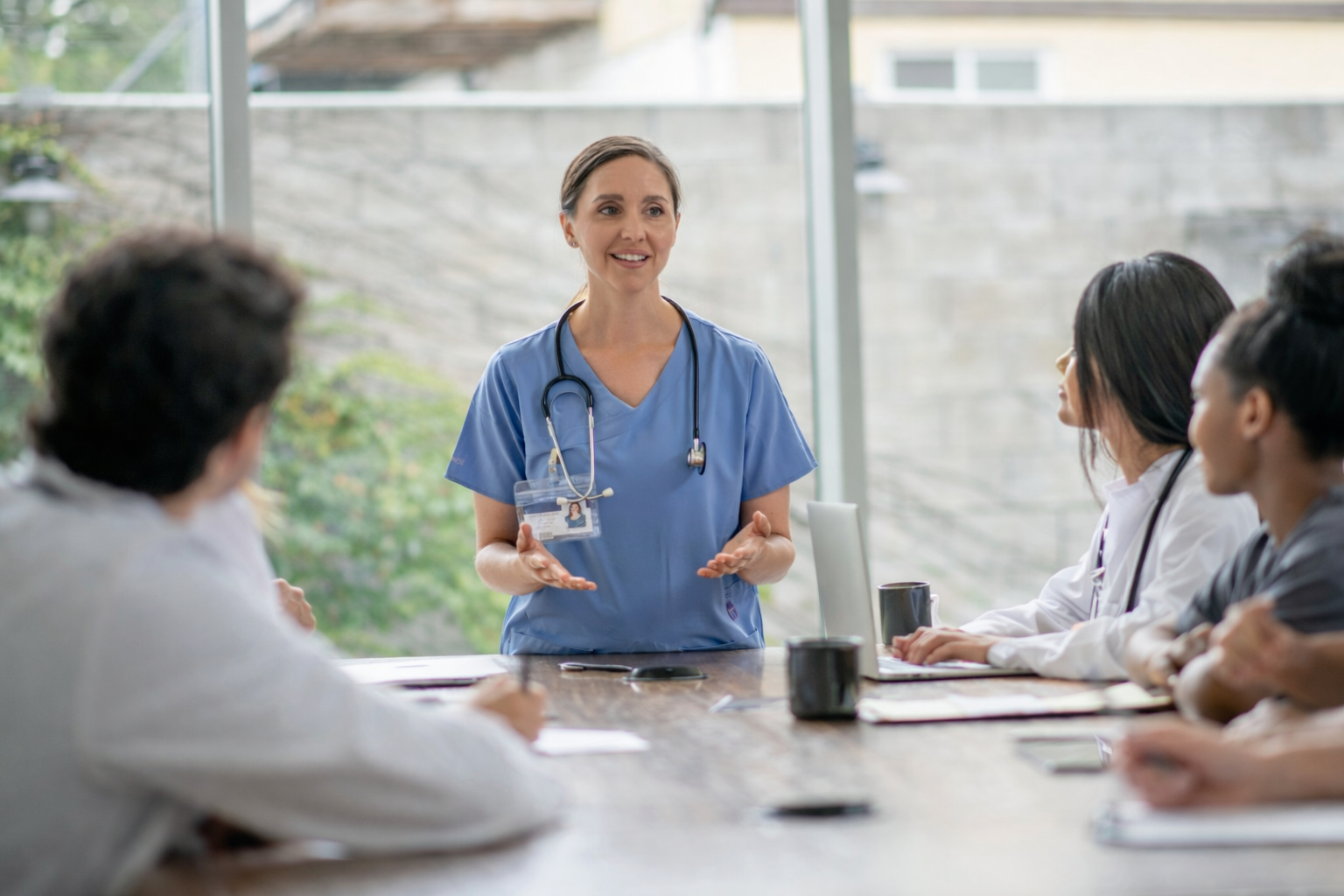 Healthcare department manager meeting with clinical team leads